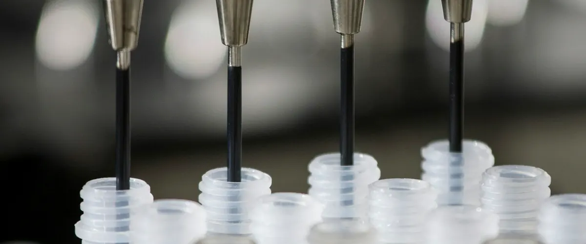 Test probes lowered over a row of soft samples